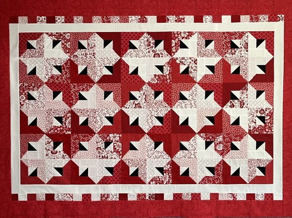Quilt-a-Whirl quilt made with Jelly Roll fabric strips