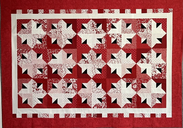 Quilt-a-Whirl quilt made with Jelly Roll fabric strips